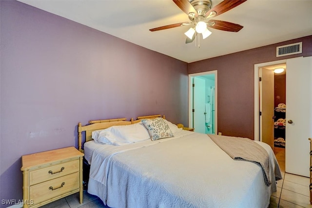 tiled bedroom featuring ceiling fan