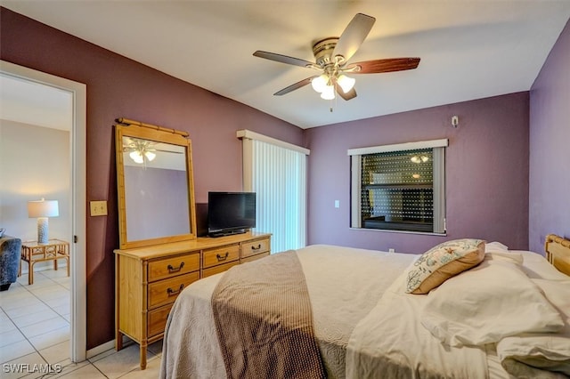 tiled bedroom with ceiling fan