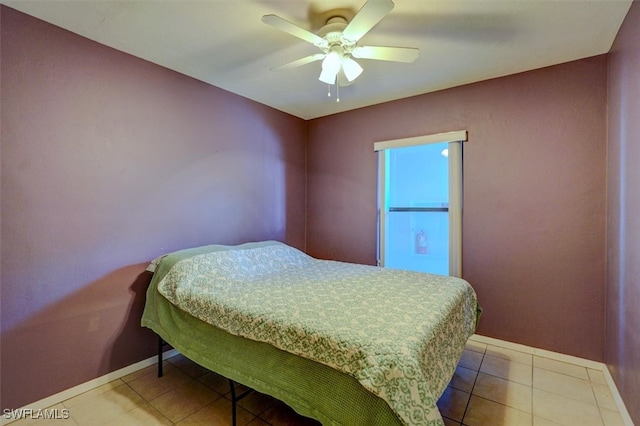 tiled bedroom with ceiling fan