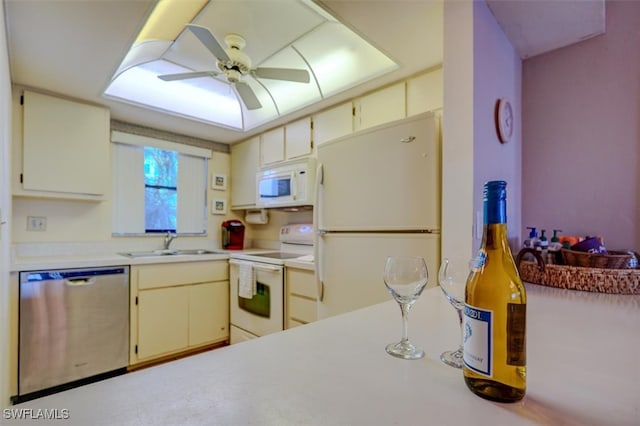 kitchen with ceiling fan, sink, and white appliances