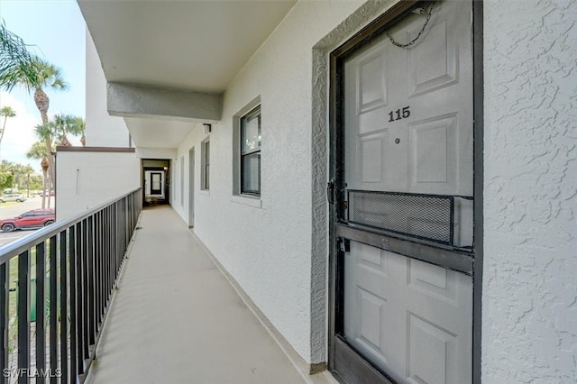 entrance to property with a balcony