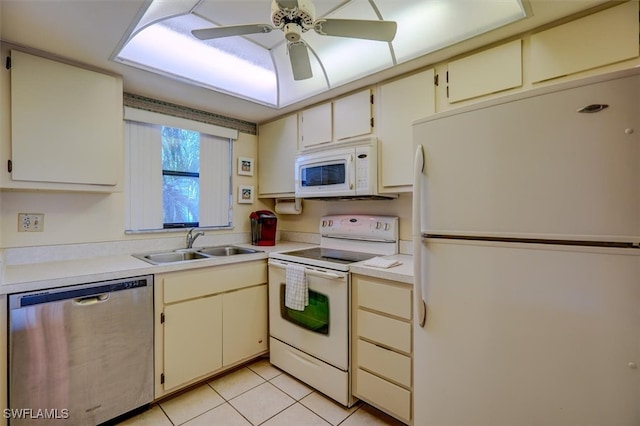 kitchen featuring sink, white appliances, light tile patterned floors, and ceiling fan