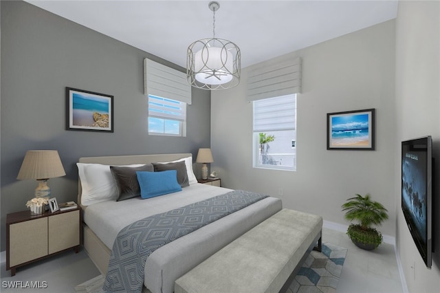 bedroom with a notable chandelier and baseboards