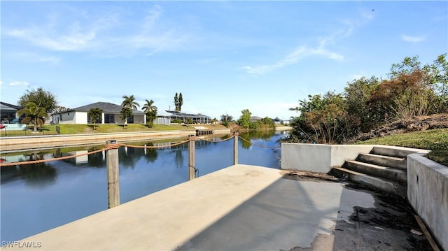 dock area featuring a water view and a residential view