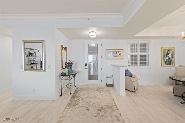 entryway with light wood-type flooring, crown molding, and an inviting chandelier