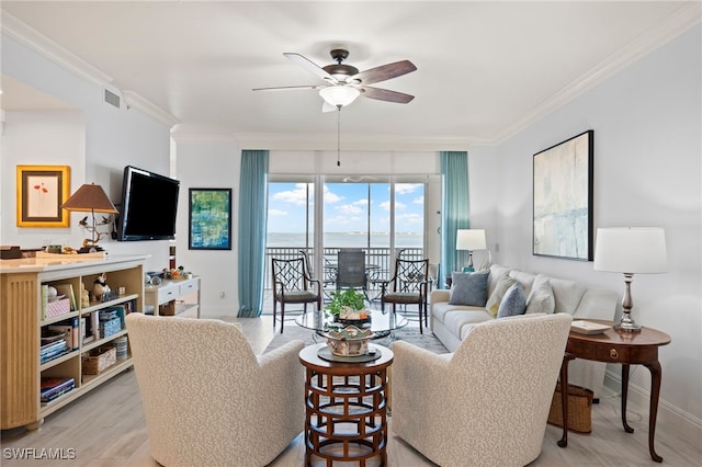 living room featuring ceiling fan, light hardwood / wood-style floors, and ornamental molding