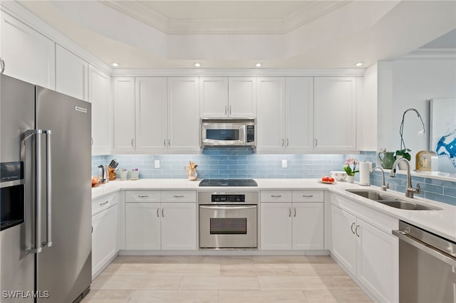 kitchen with white cabinets, sink, and appliances with stainless steel finishes