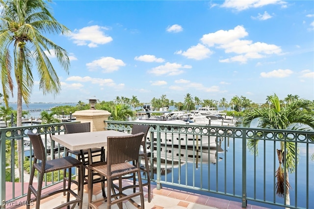 balcony featuring a water view