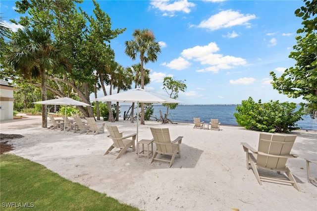 view of patio with a water view