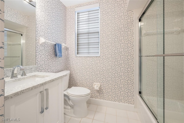 full bath with wallpapered walls, baseboards, toilet, shower / bath combination with glass door, and tile patterned flooring