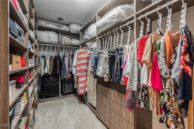 spacious closet featuring carpet and visible vents