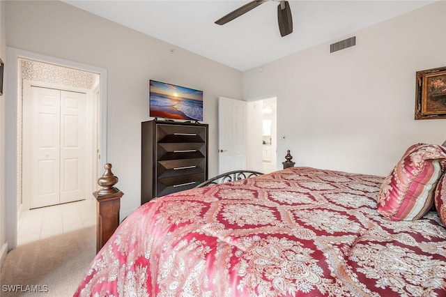 bedroom with ceiling fan, carpet floors, and visible vents