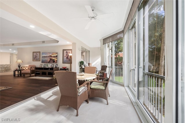 sunroom with a ceiling fan