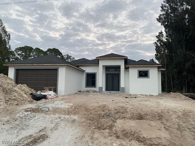 view of front of property with a garage