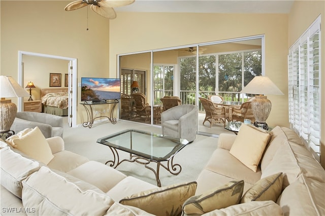 interior space with lofted ceiling and ceiling fan