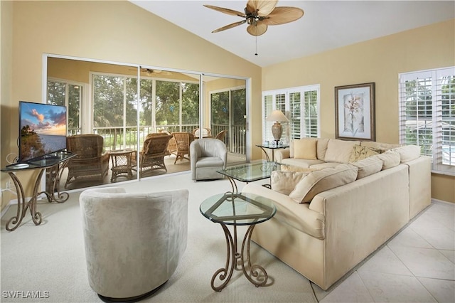 living area with lofted ceiling, a sunroom, ceiling fan, and light tile patterned floors