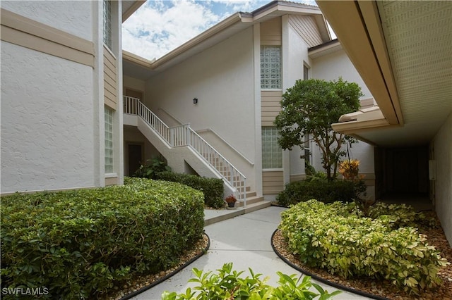 doorway to property with stucco siding