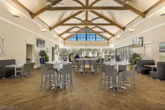 dining area with a ceiling fan, high vaulted ceiling, dark wood-type flooring, and beam ceiling