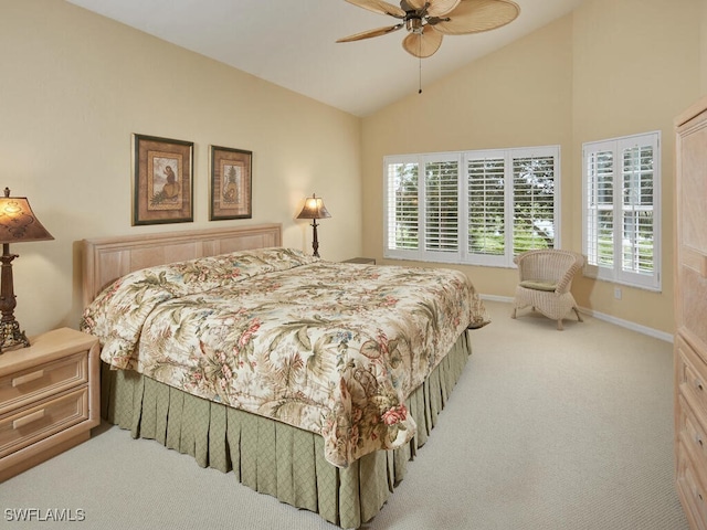 carpeted bedroom featuring a ceiling fan, lofted ceiling, and baseboards