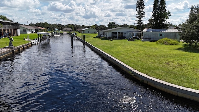 exterior space with a water view and a yard