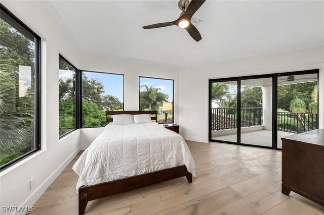 bedroom featuring light hardwood / wood-style floors, access to exterior, and ceiling fan