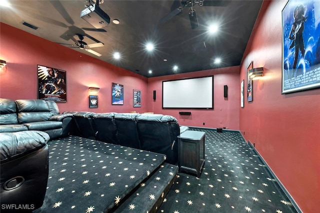 home theater room featuring carpet and ceiling fan