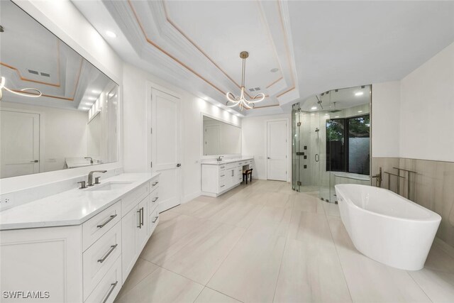 bathroom featuring vanity, shower with separate bathtub, tile patterned flooring, and a raised ceiling