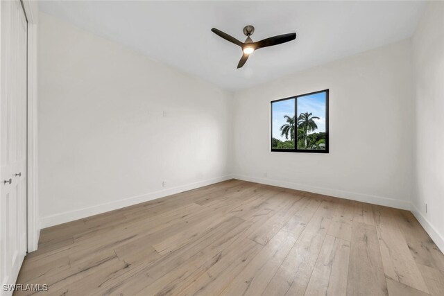 empty room featuring light hardwood / wood-style floors and ceiling fan