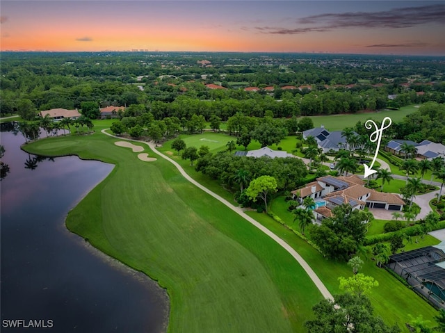 aerial view at dusk with a water view