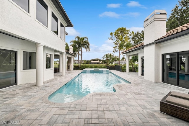 view of swimming pool with a patio area