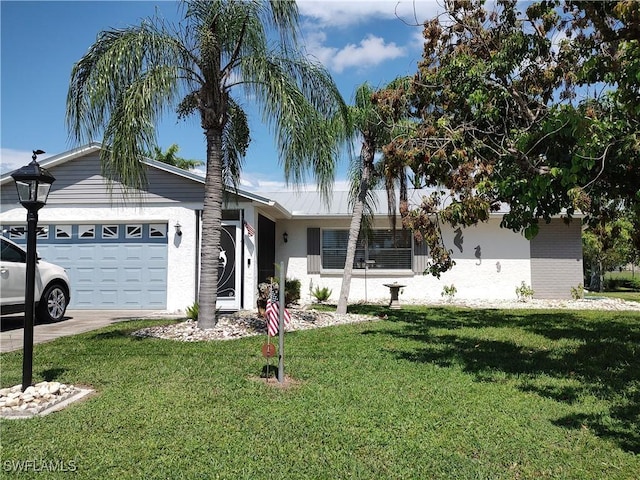 ranch-style home featuring a garage, stucco siding, driveway, and a front lawn