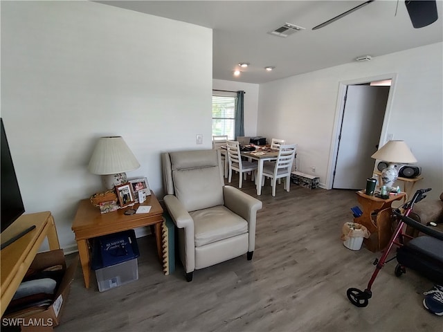 sitting room with hardwood / wood-style floors