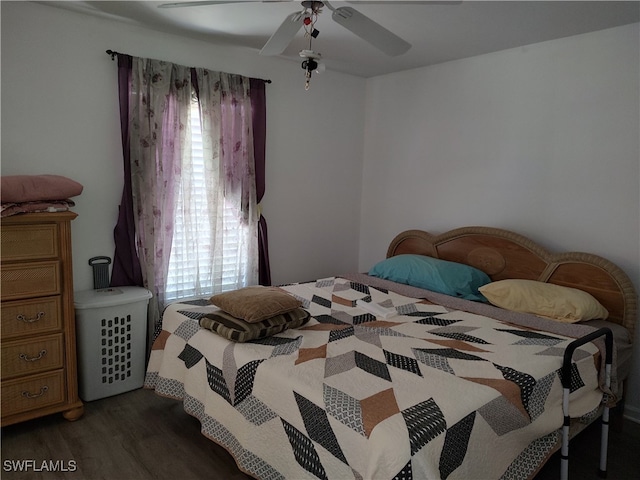 bedroom featuring ceiling fan and dark wood-type flooring