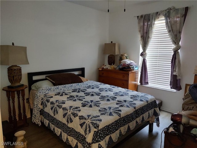 bedroom featuring wood finished floors