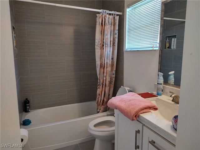 full bathroom featuring shower / bathtub combination with curtain, tile patterned flooring, vanity, and toilet