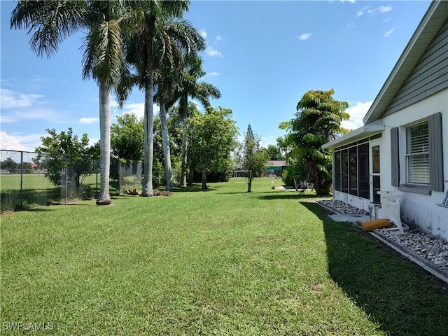 view of yard with a sunroom