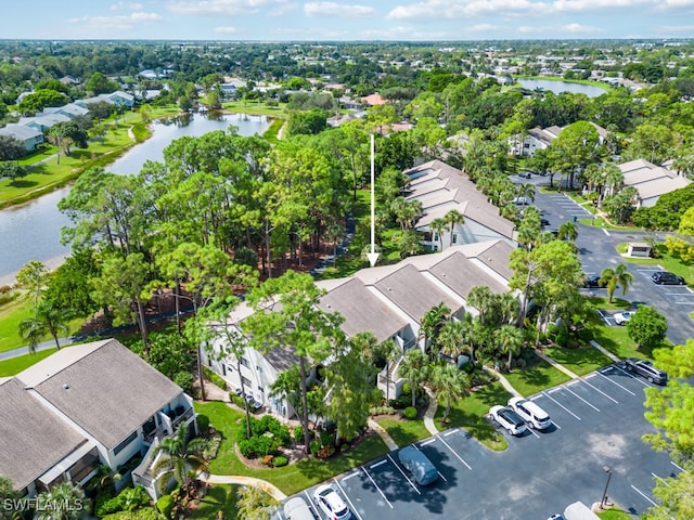 birds eye view of property featuring a water view