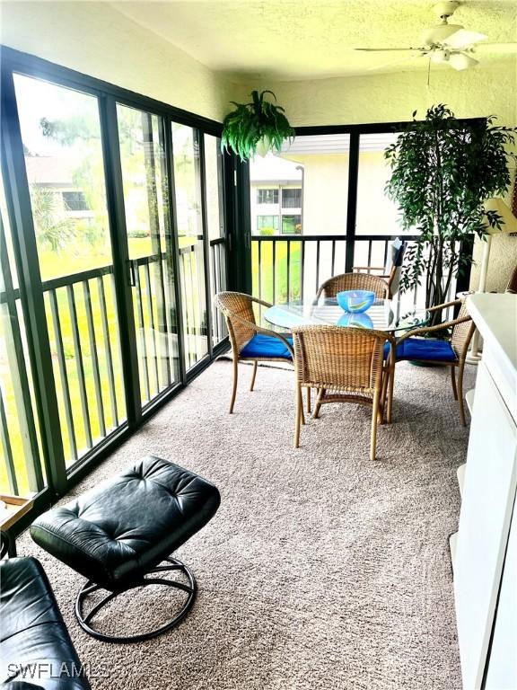 5925 Trailwinds Dr Unit 926, Fort Myers, FL 33907 - sunroom / solarium featuring carpet