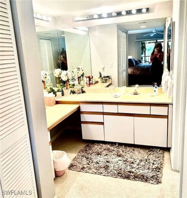 5925 Trailwinds Dr Unit 926, Fort Myers, FL 33907 - bathroom featuring a closet, connected bathroom, ceiling fan, and vanity