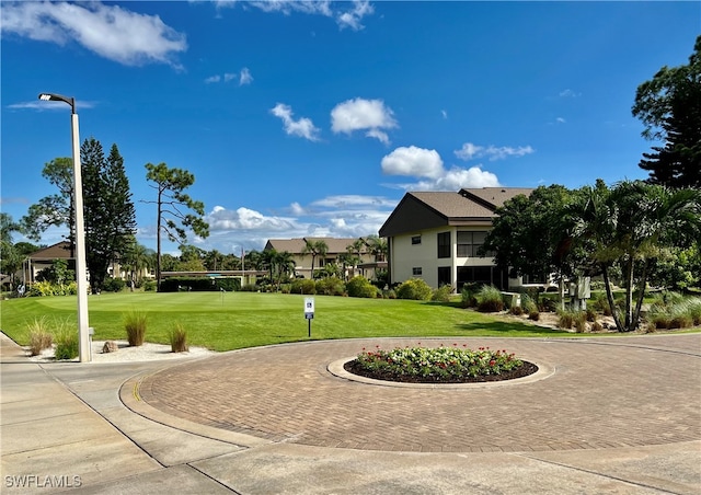 view of home's community featuring a yard