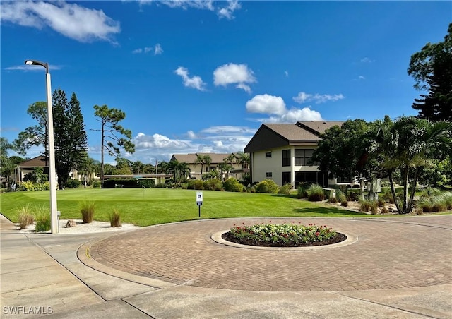 5925 Trailwinds Dr Unit 926, Fort Myers, FL 33907 - view of community with a residential view and a lawn
