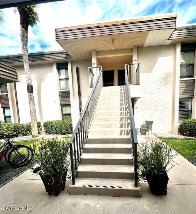 5925 Trailwinds Dr Unit 926, Fort Myers, FL 33907 - doorway to property with stucco siding