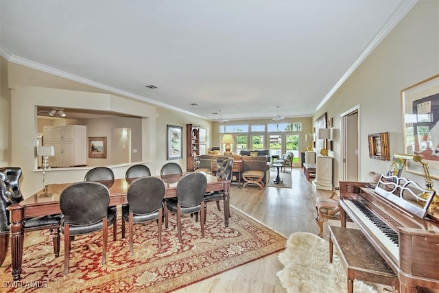 dining space with crown molding, light hardwood / wood-style floors, and ceiling fan