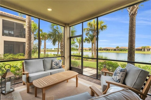 sunroom with a water view