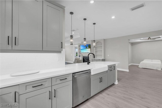 kitchen with stainless steel dishwasher, ceiling fan, and gray cabinetry