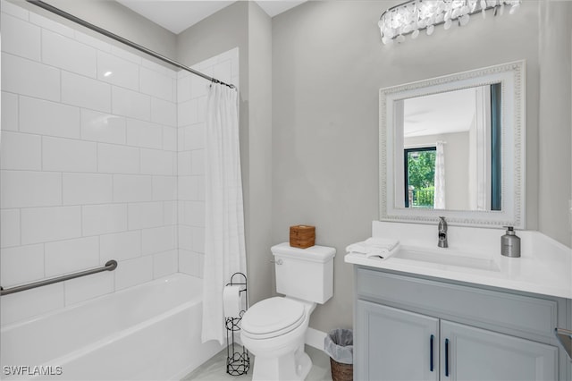 full bathroom with vanity, toilet, and shower / bath combo with shower curtain