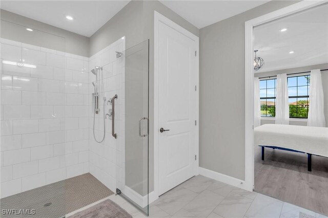 bathroom featuring a tile shower