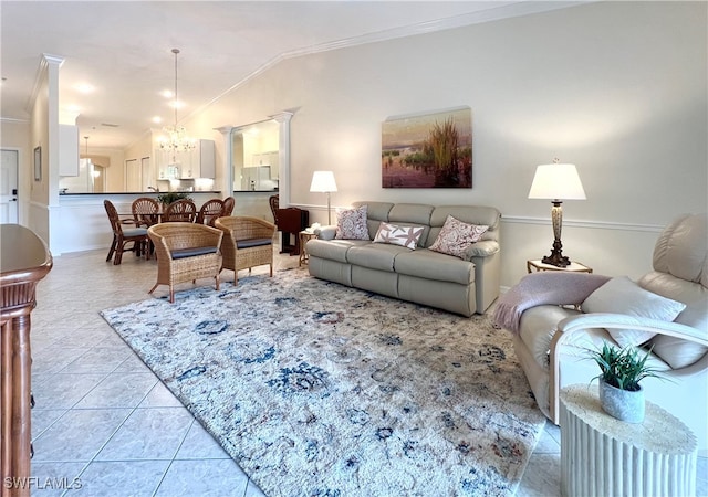 tiled living room with ornamental molding, an inviting chandelier, decorative columns, and vaulted ceiling