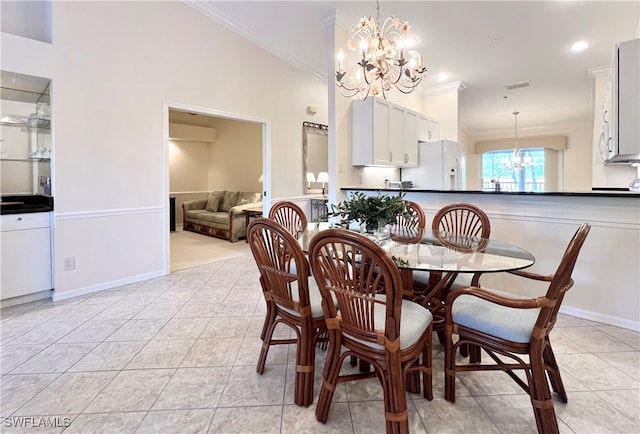 tiled dining area featuring a notable chandelier, high vaulted ceiling, and ornamental molding