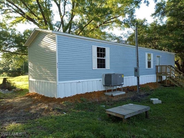 view of home's exterior with central AC